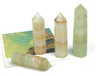Afghanistan Jade Obelisk Tower Crystal from GemstoneGO, featuring a polished green gemstone obelisk with natural stone patterns.
