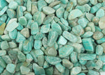 Close-up of Amazonite crystal chips, semi-tumbled stones in 7-12mm size, showcasing blue-green mineral with natural variations.