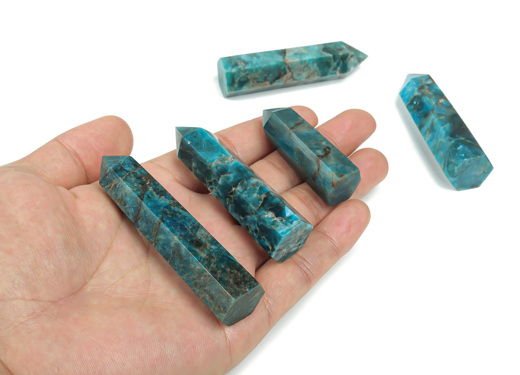 Blue Apatite Quartz obelisk crystal tower from GemstoneGO, showcasing a polished blue gemstone with natural crystal points