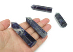 Sodalite obelisk tower crystal from GemstoneGO featuring deep blue and white mineral patterns on a polished stone.