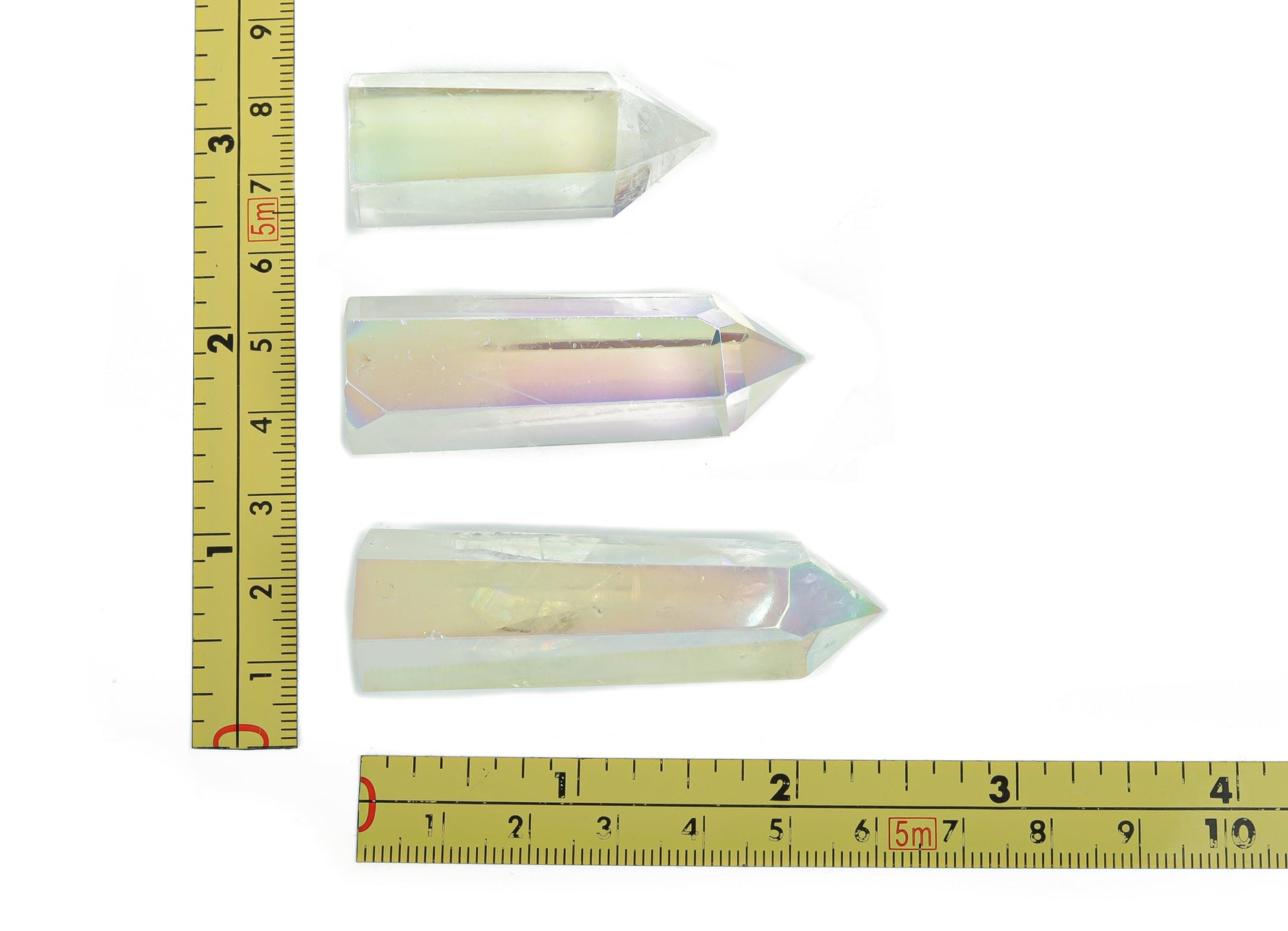 Angel Aura Quartz obelisk tower crystal by GemstoneGO, featuring a luminous, iridescent finish and pointed crystal structure.