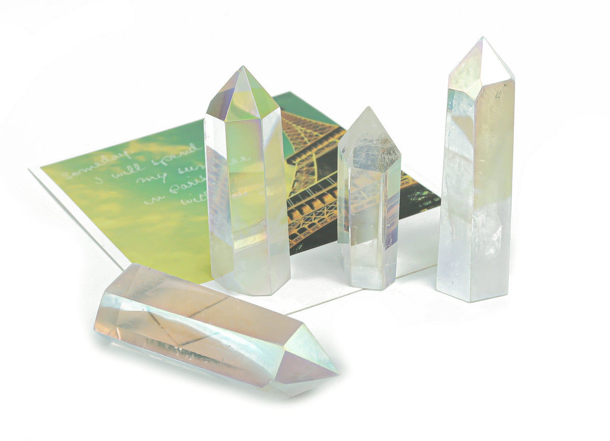 Angel Aura Quartz obelisk tower crystal from GemstoneGO, showcasing a shimmering, luminous crystal with a pointed obelisk shape.