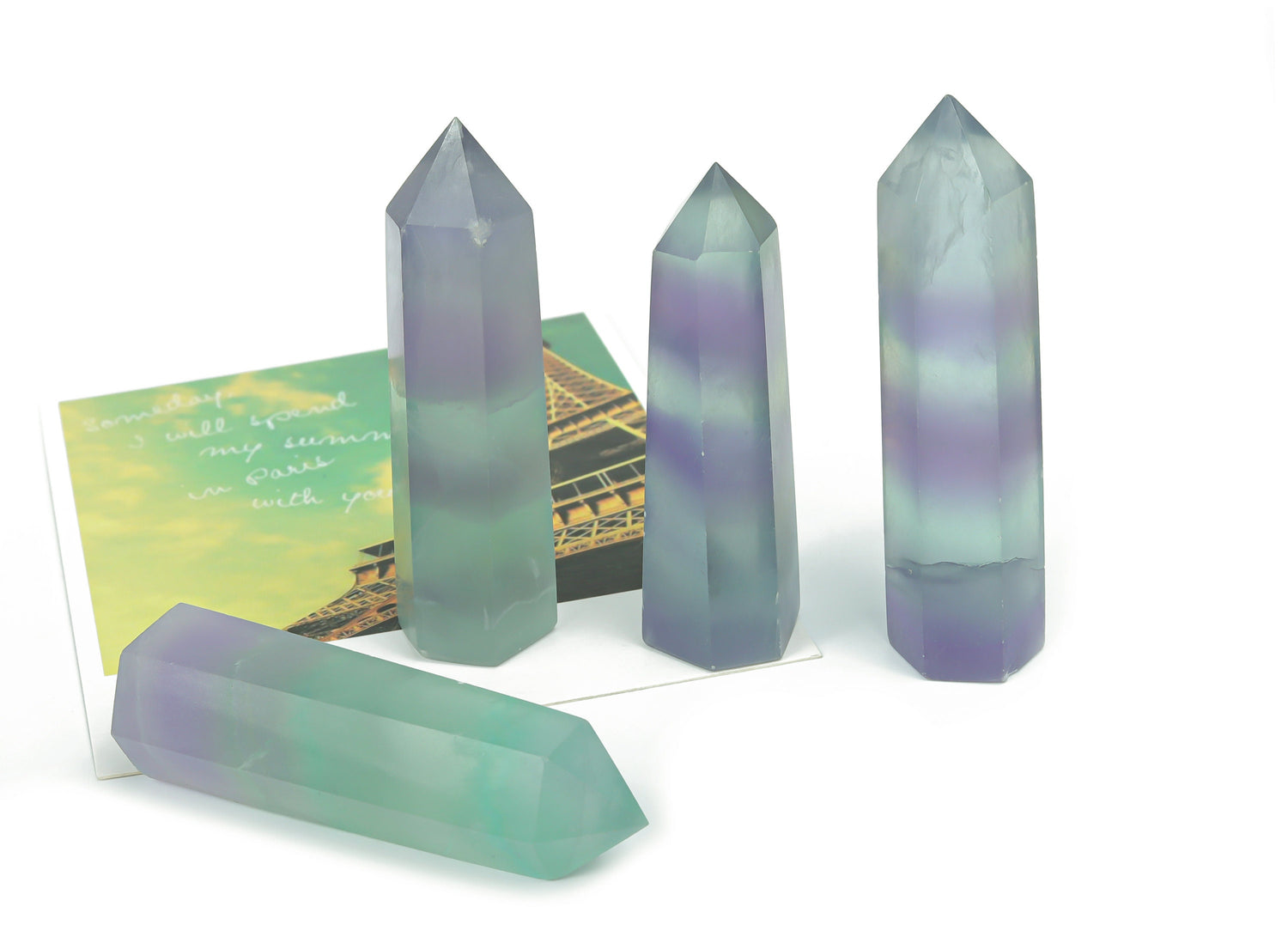 Blue fluorite obelisk tower crystal from GemstoneGO, featuring a polished, vibrant mineral stone with natural striations and a pointed top.