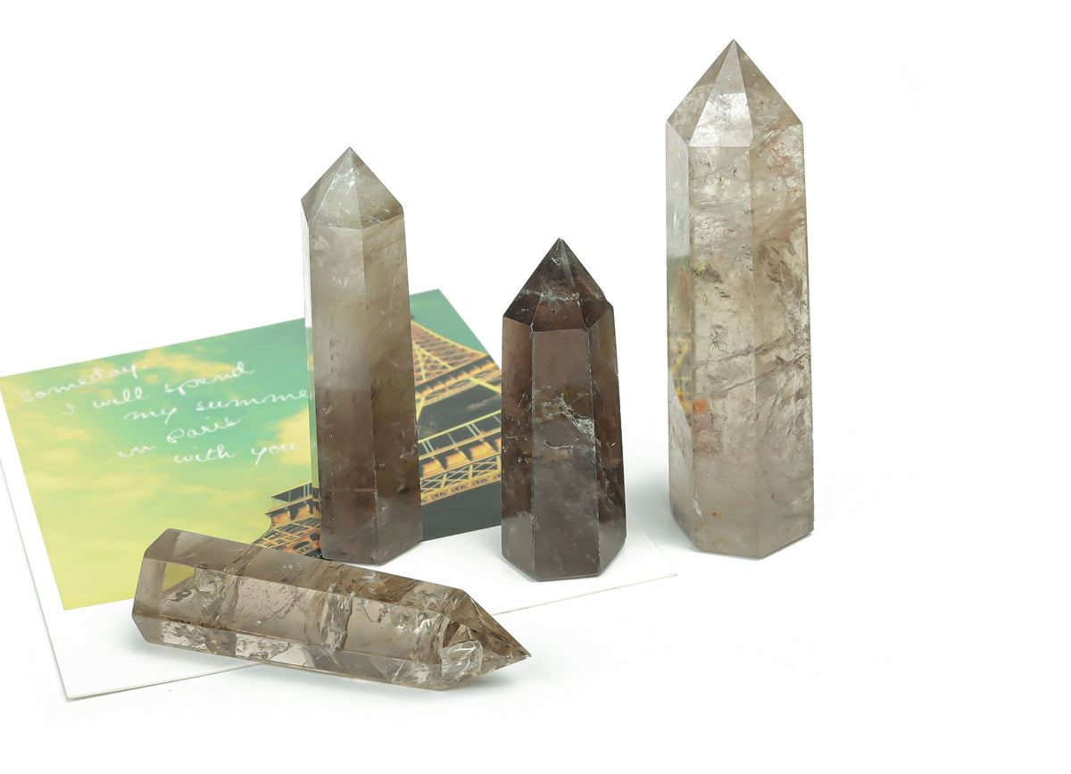 Smoky quartz obelisk tower crystal from GemstoneGO, showing a dark, polished gemstone with natural crystal formations.