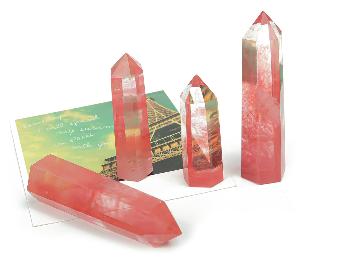 Cherry Quartz obelisk tower crystal from GemstoneGO, showcasing a polished red quartz crystal with a pointed obelisk shape.