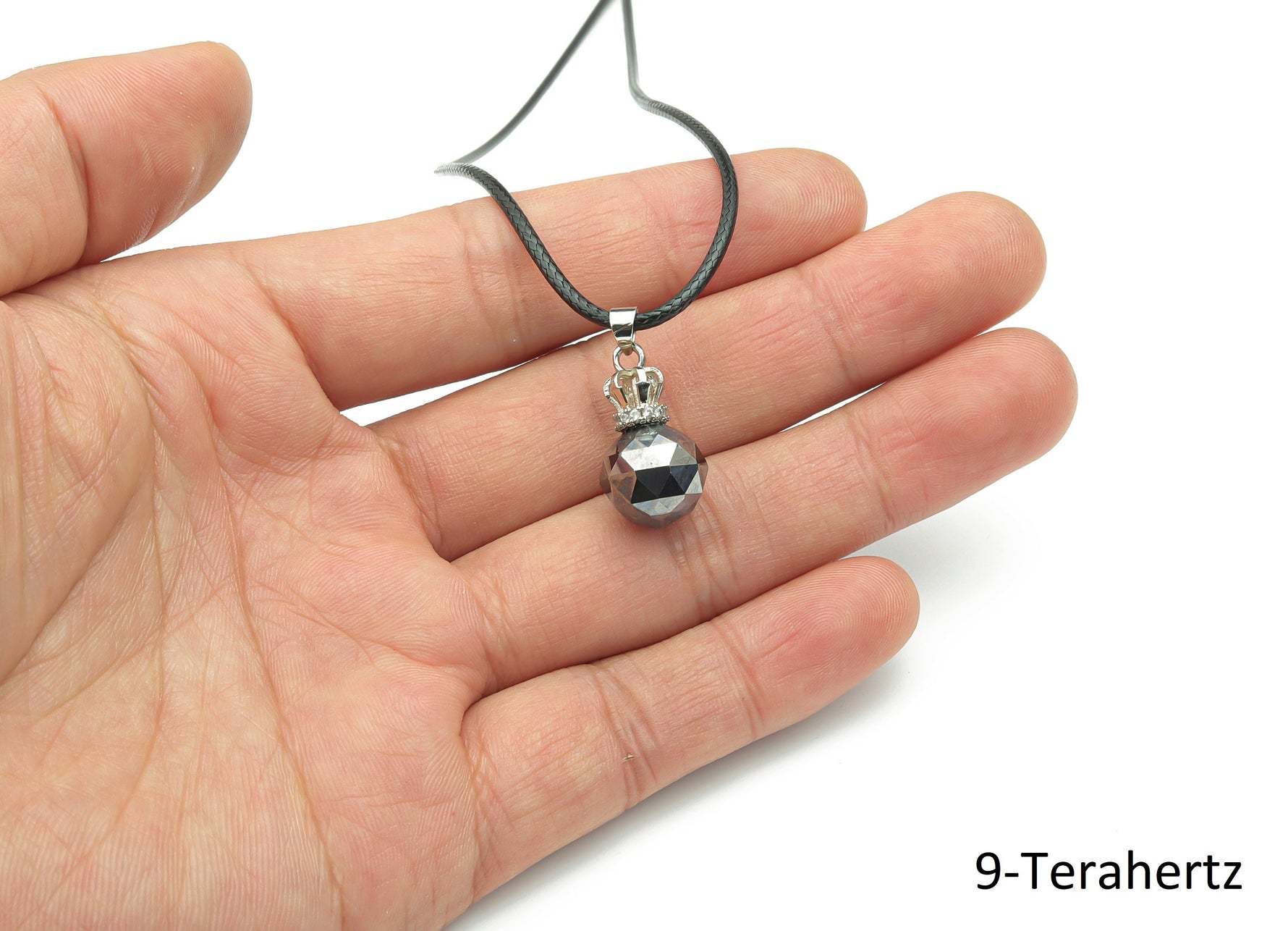 Terahertz crystal cord necklace featuring a healing gemstone, showcasing a polished gemstone pendant on a black cord.