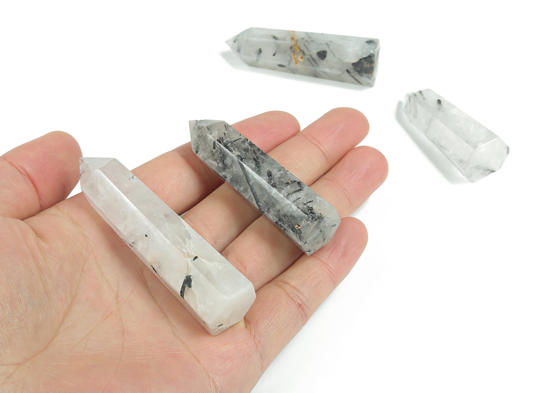 Tourmalinated Quartz obelisk tower crystal from GemstoneGO featuring black tourmaline inclusions in clear quartz.