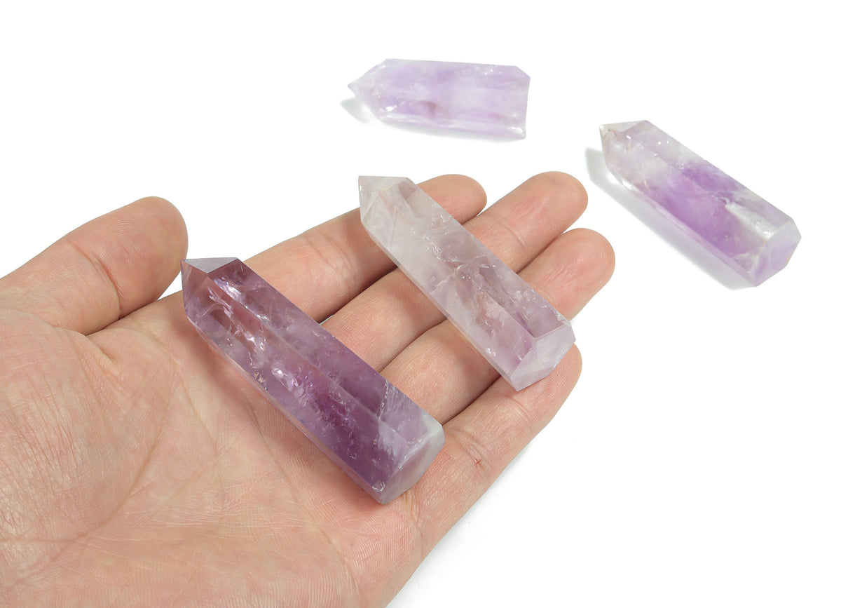 Amethyst obelisk tower crystal from GemstoneGO showcasing purple gemstone with natural crystal formations and polished finish.