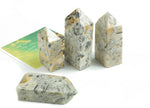 Crazy Lace Agate obelisk crystal tower from GemstoneGO, featuring vibrant multicolored banding and a pointed tip.