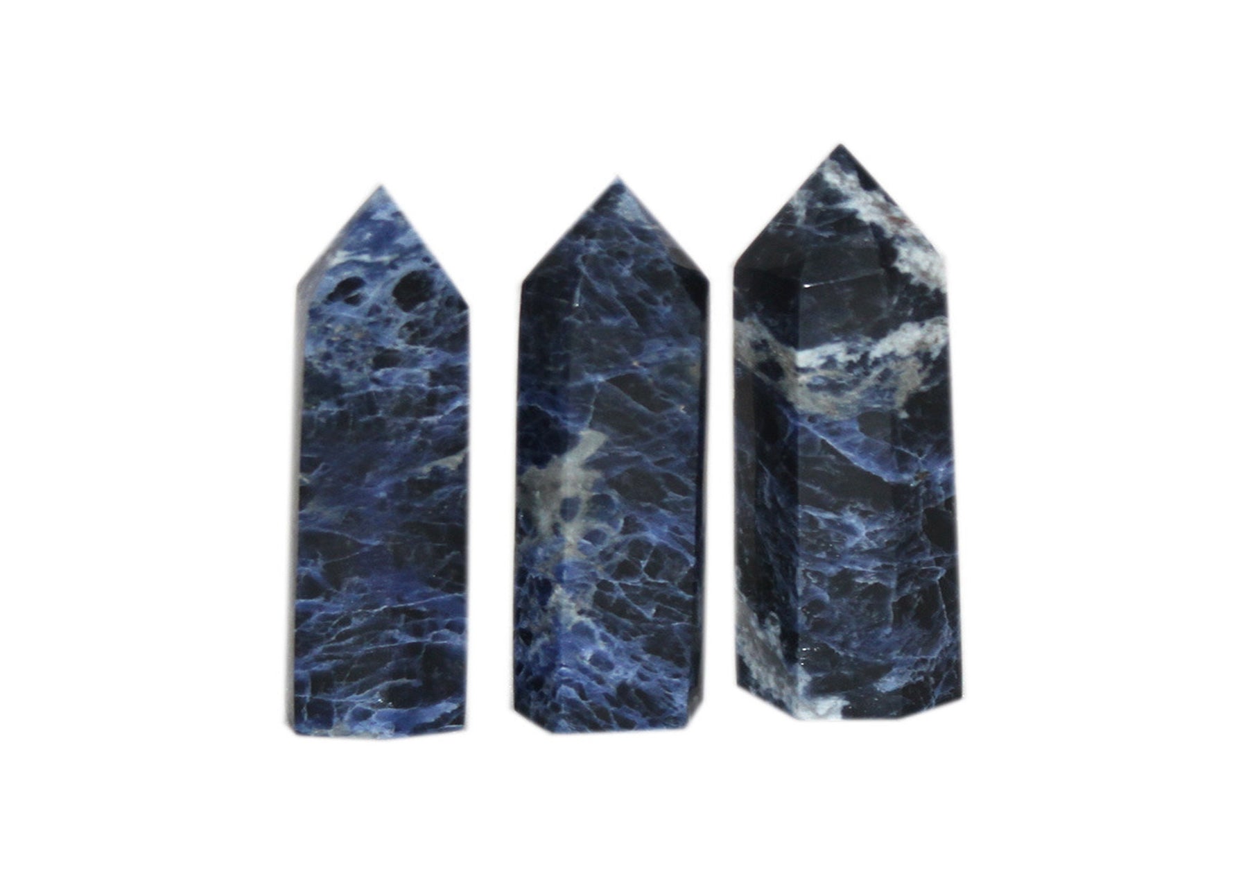 Sodalite obelisk tower crystal from GemstoneGO, featuring deep blue and white mineral patterns on a polished stone sculpture.
