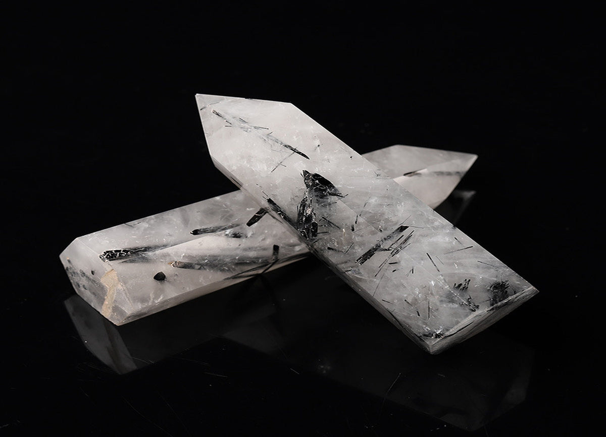Tourmalinated Quartz obelisk tower crystal from GemstoneGO, featuring black tourmaline inclusions in clear quartz.