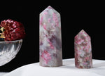 Plum Blossom Tourmaline obelisk tower crystal from GemstoneGO with vibrant pink and green hues, polished and pointed at the top.