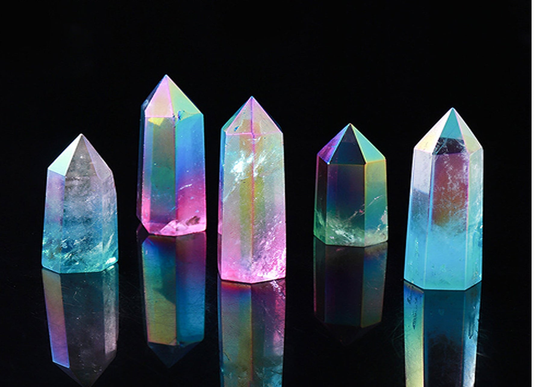 Rainbow Aura Quartz obelisk tower crystal by GemstoneGO, featuring vibrant rainbow colors and a polished crystal surface.