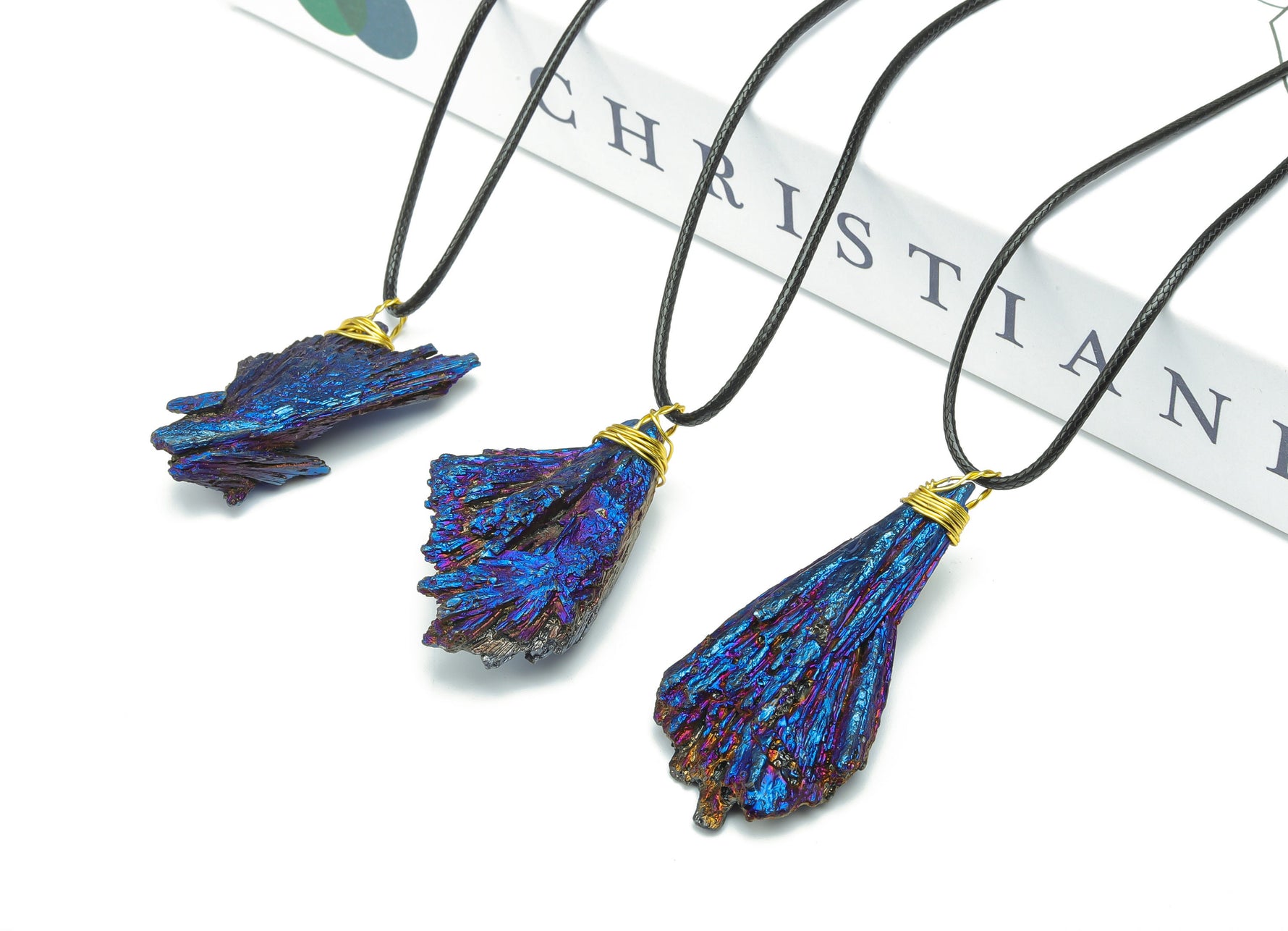 Blue Aura Kyanite fan crystal necklace on cord, showcasing vibrant blue gemstone pendant with shimmering aura finish.