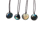 Labradorite crystal necklace on a cord, featuring polished gemstone pendant, ideal for gifts and jewelry accessories.