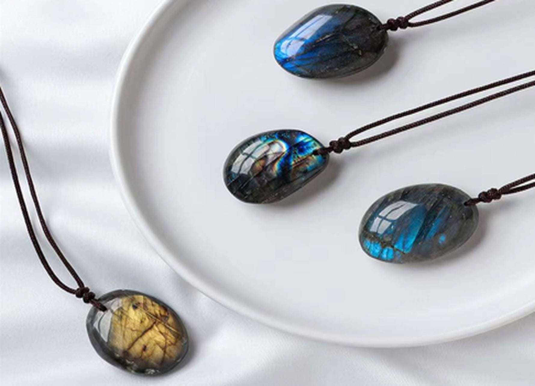 Labradorite crystal necklace on a cord, featuring a polished gemstone pendant, ideal for gifts or everyday wear.