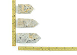 Crazy Lace Agate obelisk tower crystal from GemstoneGO, featuring vibrant, intricate banding and a polished pointed shape.