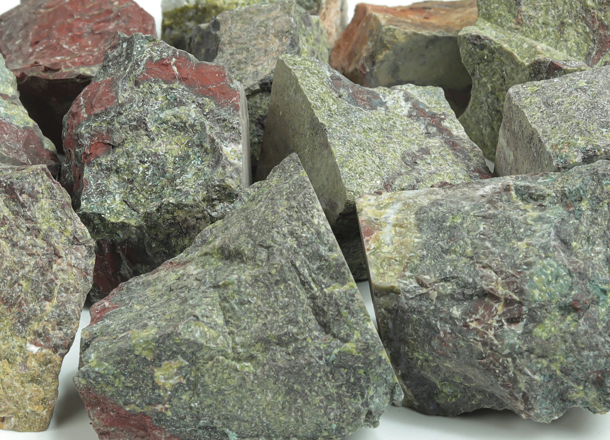 Raw Dragon Blood Jasper gemstone from GemstoneGO, showcasing deep red and brown natural mineral patterns.