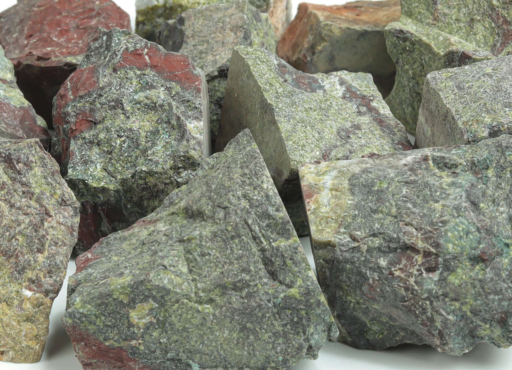 Raw Dragon Blood Jasper gemstone from GemstoneGO, showcasing deep red and brown natural mineral patterns.