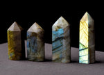 Labradorite obelisk tower crystal from GemstoneGO, featuring iridescent blue and green hues with smooth polished surfaces.