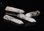 Tourmalinated Quartz obelisk tower crystal by GemstoneGO, showing black tourmaline inclusions in clear quartz stone.
