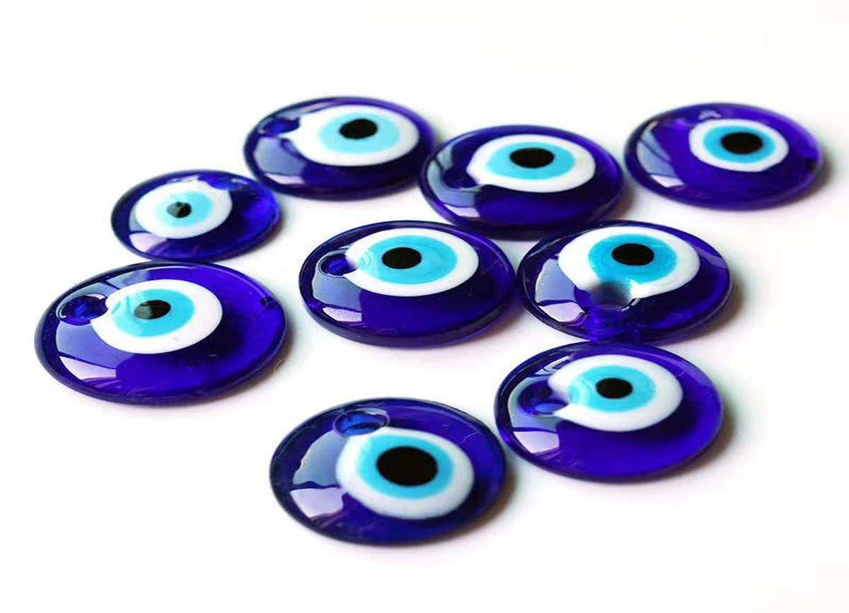 Blue glass evil eye pendant with hole, gemstone decor for home or jewelry, showcasing vibrant blue and protective design.