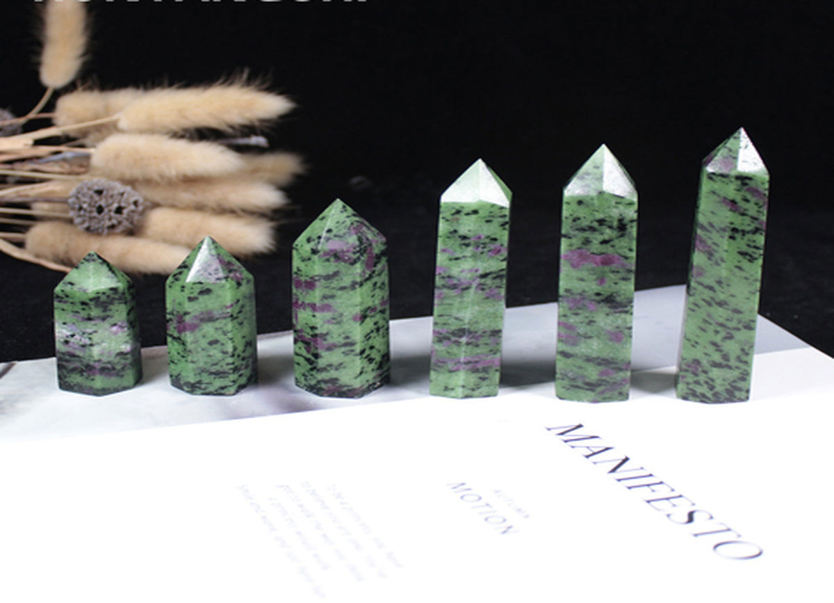 Ruby Zoisite obelisk tower crystal from GemstoneGO featuring vibrant red and green mineral patterns on a polished stone.