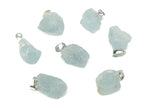 Celestite crystal pendant from GemstoneGO, showing a blue and white gemstone shaped for jewelry making on a jewelry-making supply background.