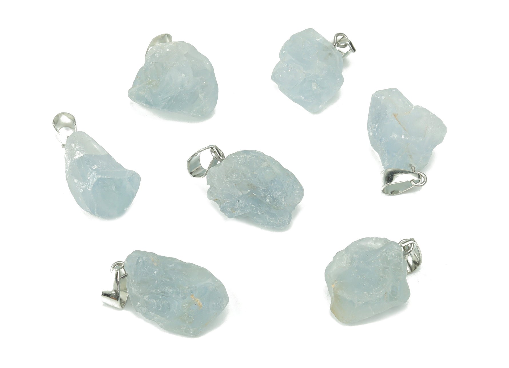 Celestite crystal pendant from GemstoneGO, showing a blue and white gemstone shaped for jewelry making on a jewelry-making supply background.