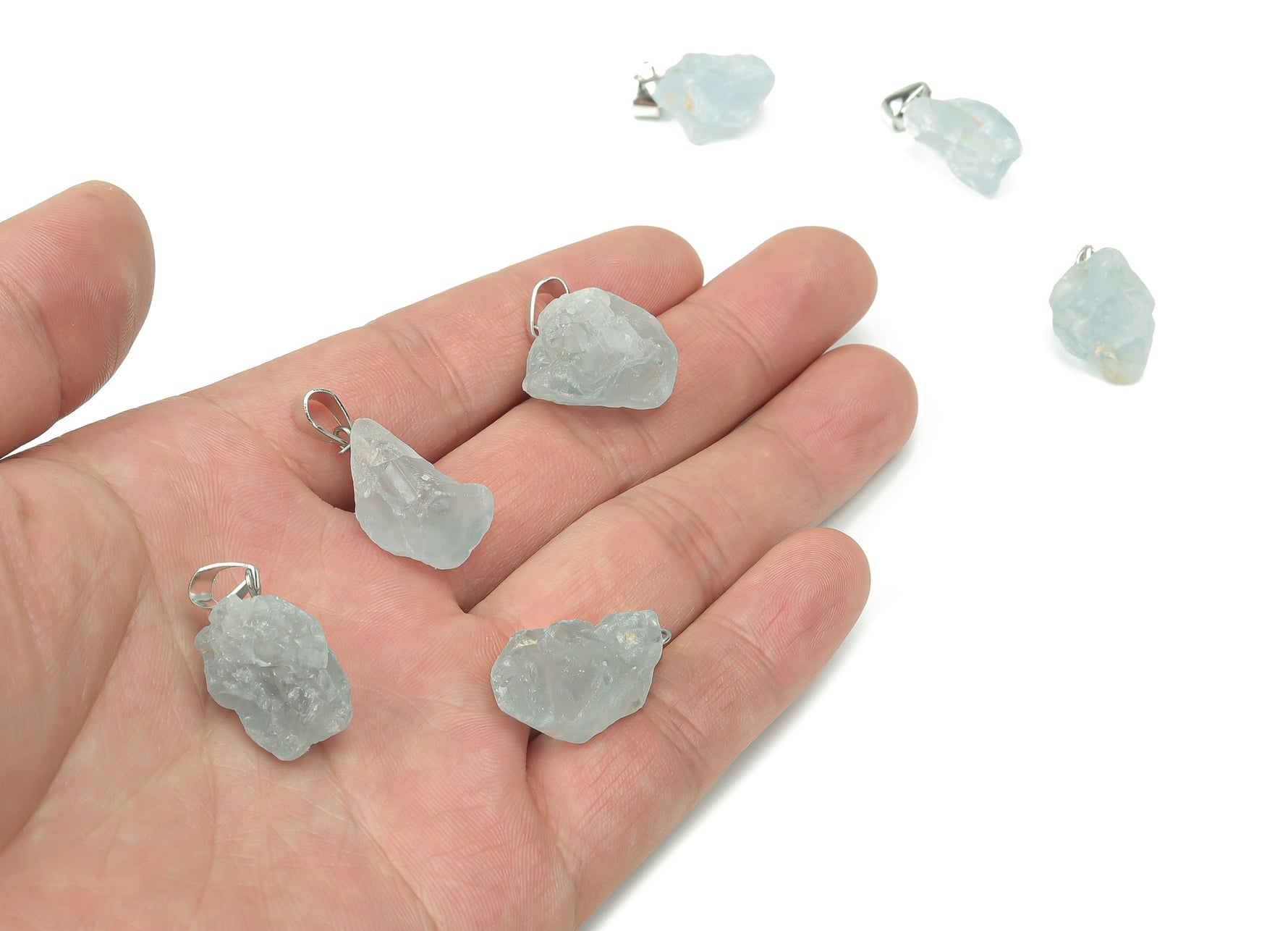 Celestite crystal pendant for jewelry making, showcasing the pale blue gemstone with silver bail attachment.
