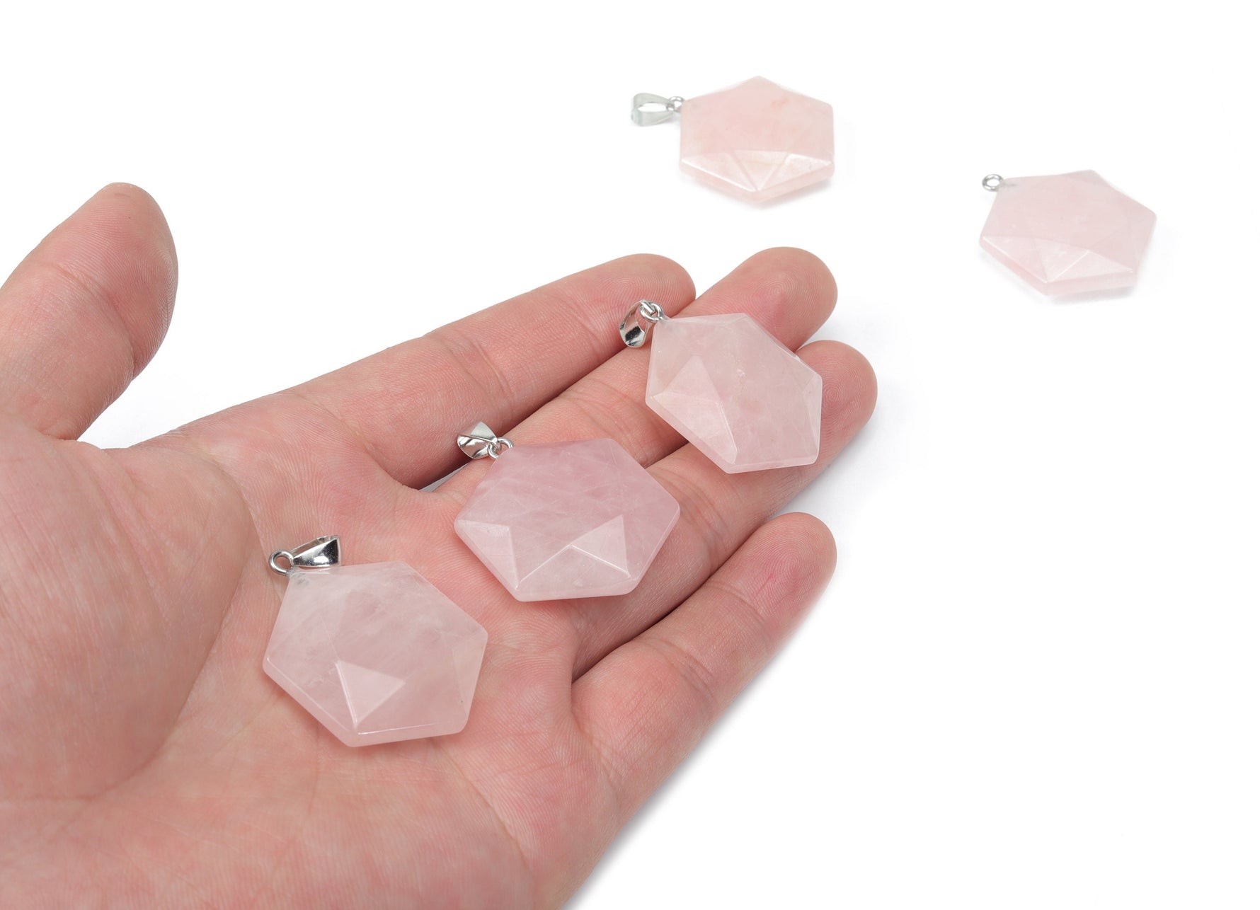 Rose quartz star Merkaba crystal pendant from GemstoneGO, featuring a polished gemstone with a star shape for jewelry making.