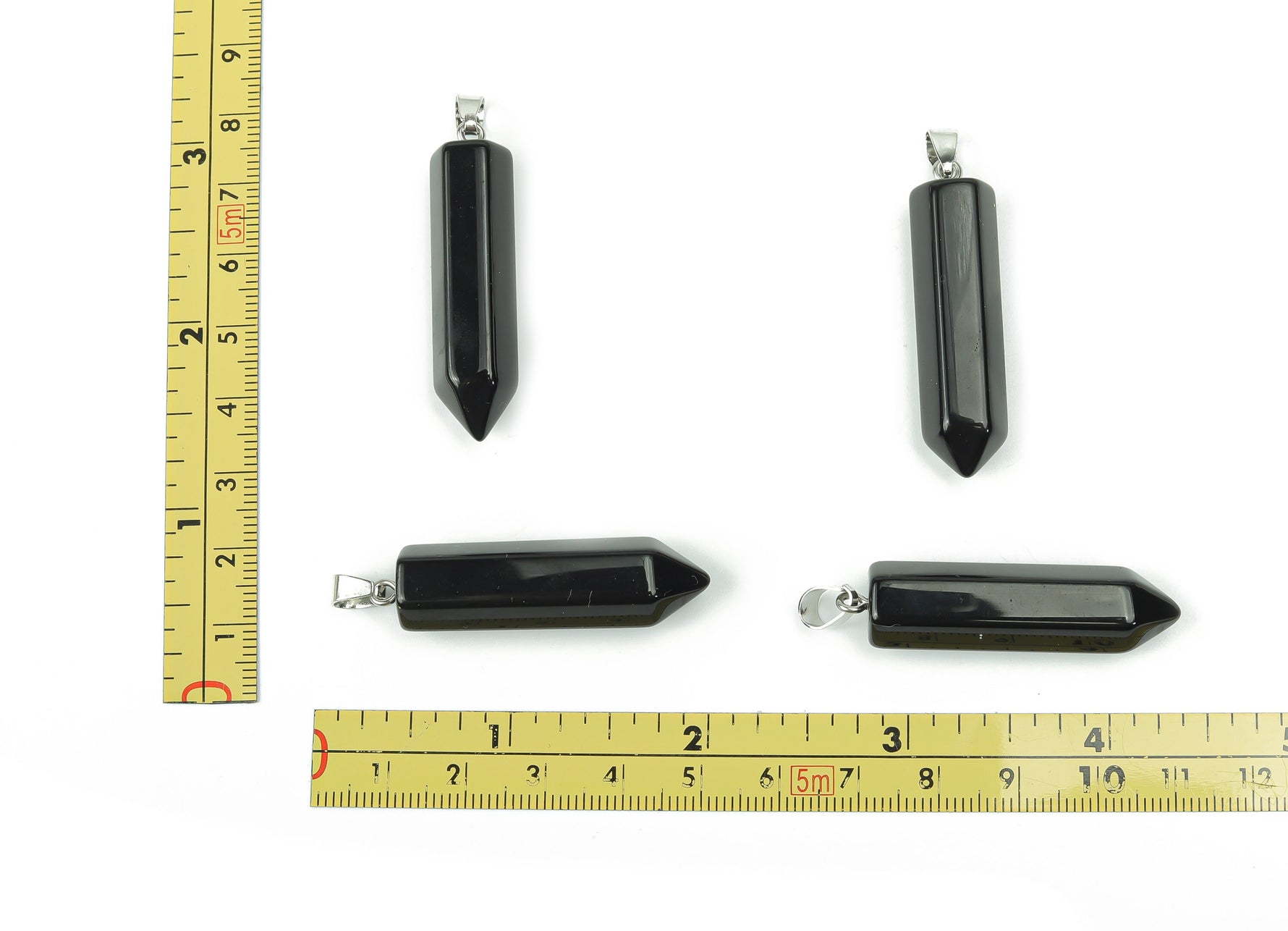 Obsidian point crystal pendant from GemstoneGO, showcasing a sleek black gemstone with natural facets, ideal for jewelry making.