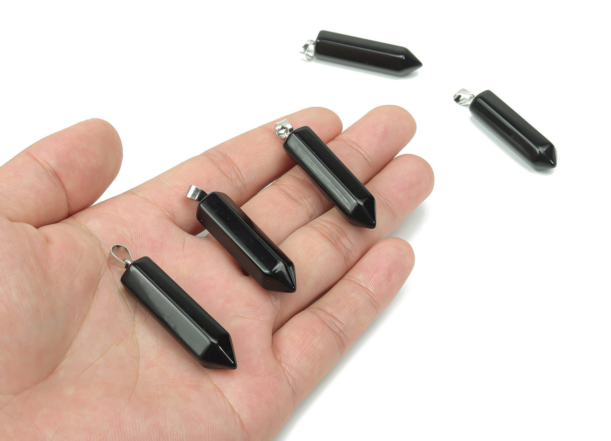 Obsidian point crystal pendant from GemstoneGO, showcasing a sleek black gemstone with natural sharp edges for jewelry making.