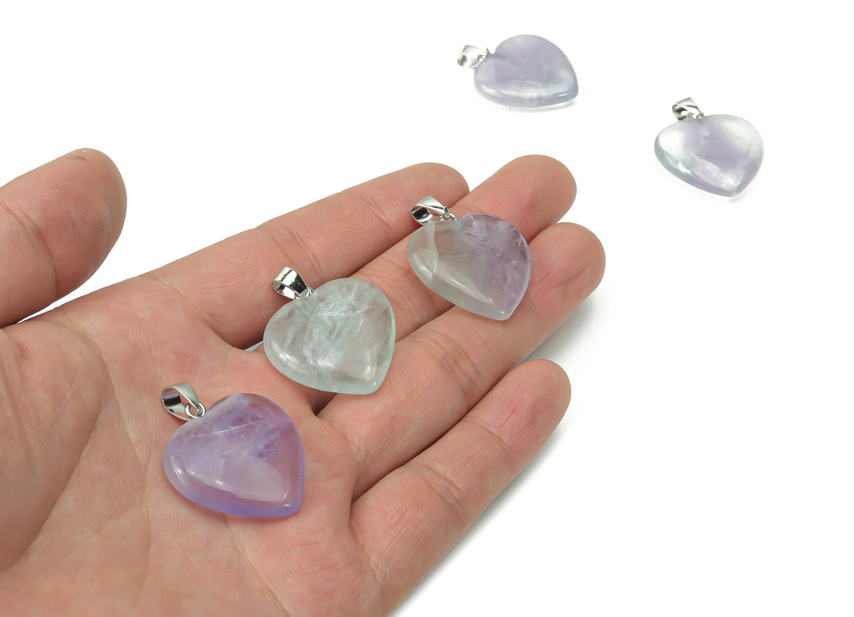 Green fluorite heart crystal pendant from GemstoneGO, ideal for jewelry making, showcasing a polished heart-shaped gemstone.