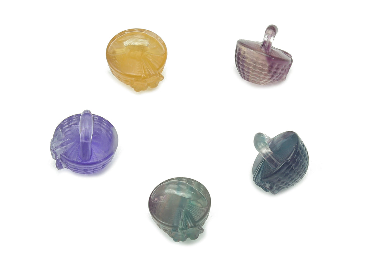 Fluorite garden basket carving gemstone from GemstoneGO showcasing vibrant green and purple hues in a detailed carved design.