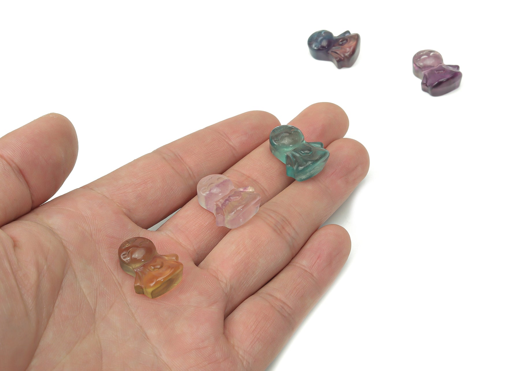 Fluorite angel kid gemstone carving from GemstoneGO, showing a detailed, colorful angel figure made of vibrant fluorite crystal.
