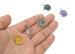 Mini fluorite turtle gemstone carving by GemstoneGO, showcasing vibrant purple and green hues on a smooth polished surface.