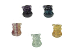 Colorful fluorite gemstone carved into a cute animal figure, showcasing vibrant hues and detailed craftsmanship by GemstoneGO.