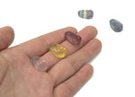 Mini Fluorite Buddha carving gemstone from GemstoneGO, detailed stone sculpture with vibrant green and purple hues.