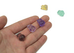 Fluorite owl carving gemstone from GemstoneGO showcasing vibrant purple and green hues with detailed owl features.