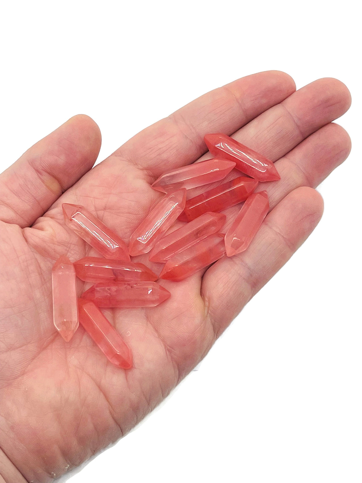 Cherry quartz terminated carved point, 33mm gemstone from GemstoneGO, showing a pointed, polished crystal with natural red hues.