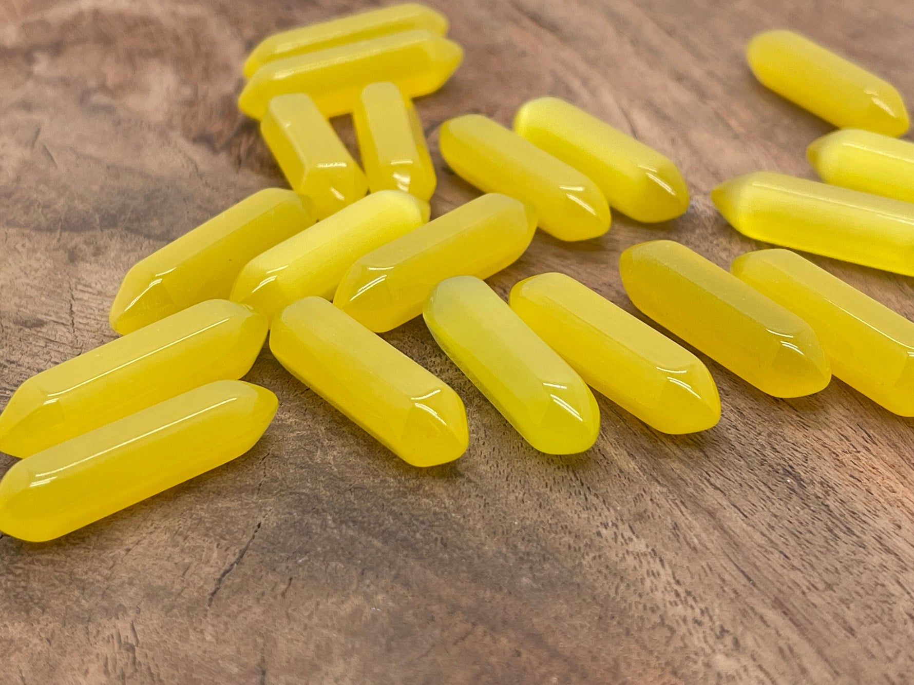 Yellow Cats Eye gemstone carved point, 33mm, with a terminated shape and polished surface, from GemstoneGO.