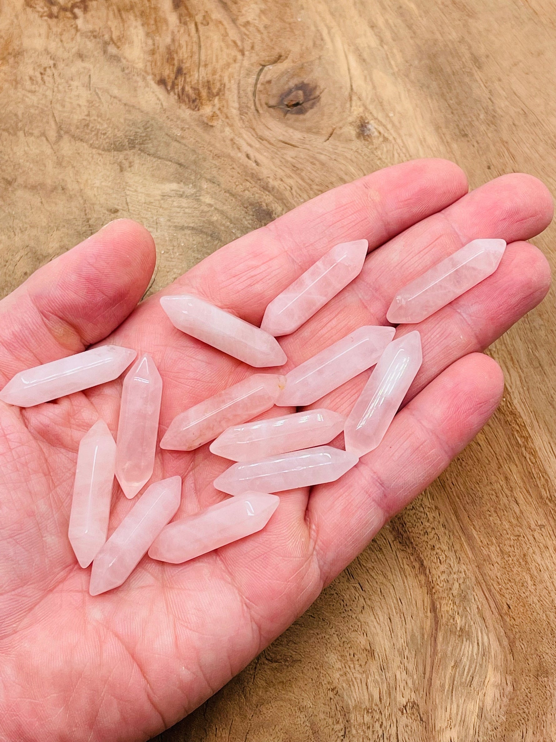 Rose quartz terminated carved point, 33mm gemstone from GemstoneGO, showcasing smooth pink stone with natural crystal facets.