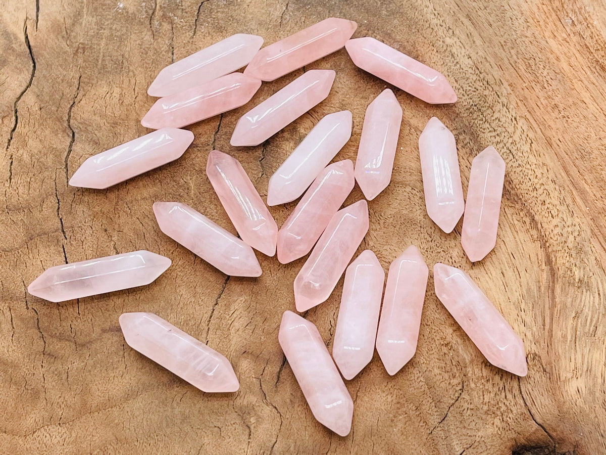 Rose Quartz terminated carved point gemstone, 33mm, from GemstoneGO, showcasing a smooth, natural pink quartz crystal with carved tip.