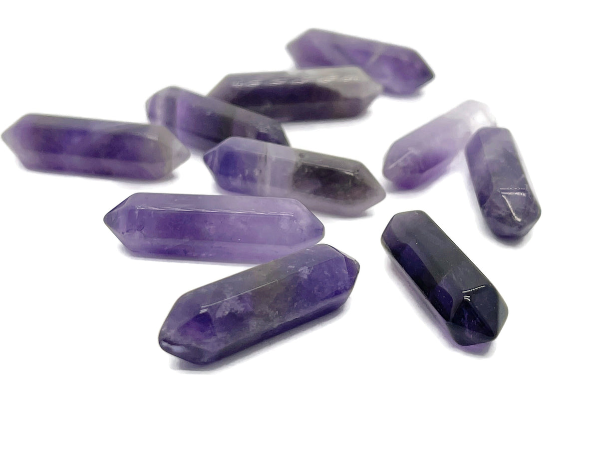 Amethyst terminated carved point gemstone, 33mm, from GemstoneGO showing deep purple color and detailed natural carving.
