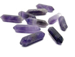 Amethyst terminated carved point gemstone, 33mm, from GemstoneGO showing deep purple color and detailed natural carving.