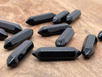 Obsidian terminated carved point gemstone from GemstoneGO, 33mm length, with polished and textured surface details.
