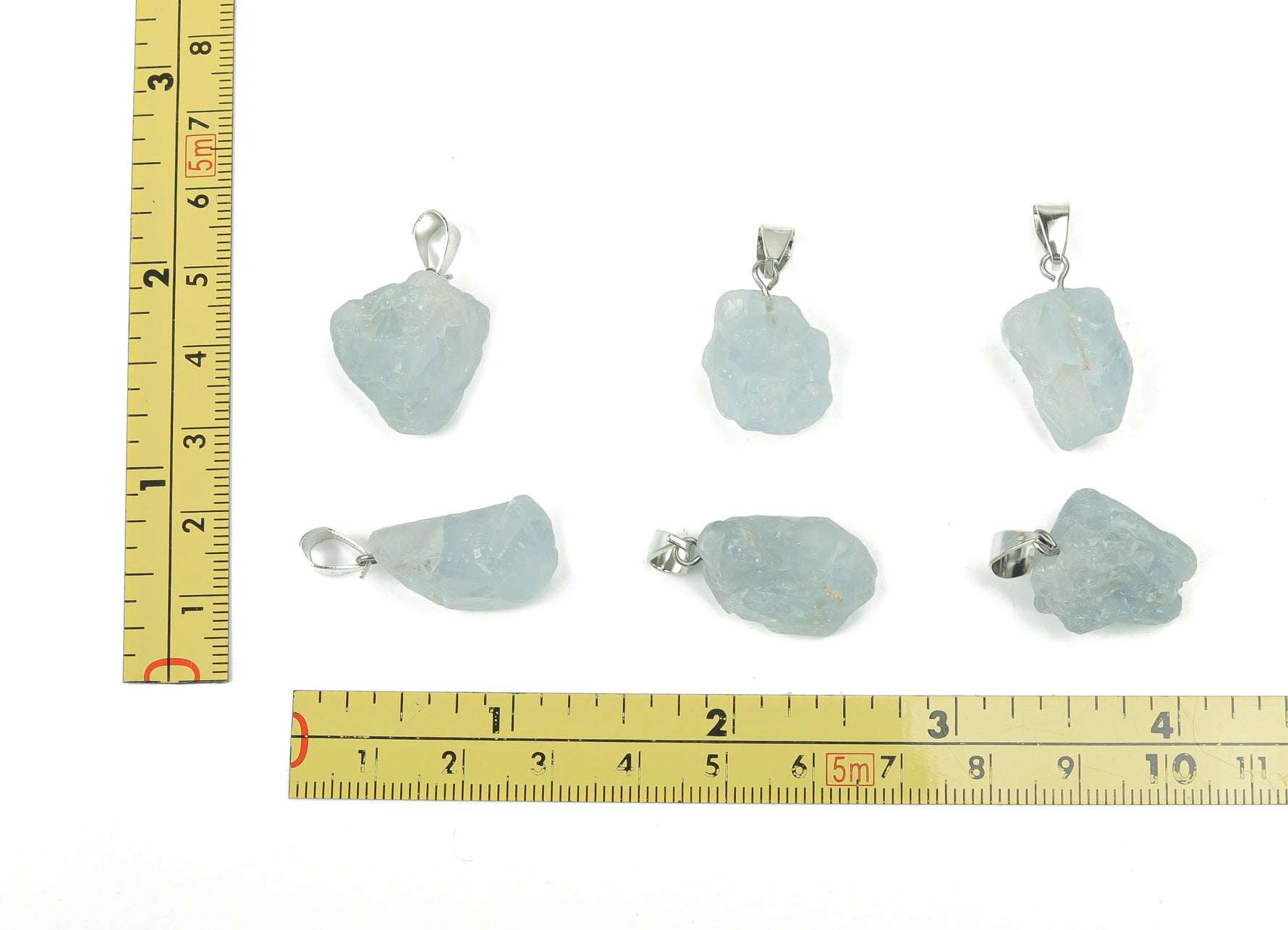 Celestite crystal pendant from GemstoneGO, showcasing a blue gemstone in a jewelry making supply, with silver bail attachment.