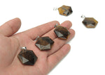 Tiger Eye Star Merkaba crystal pendant from GemstoneGO, featuring a polished gemstone pendant with star and Merkaba shapes for jewelry.