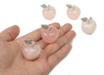 Rose quartz apple-shaped crystal carving from GemstoneGO, 30mm, with smooth polished surface and natural pink gemstone details.